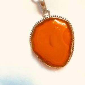 1 1/2 inch, Banded Carnelian, Druzy slice pendant on a silver chain.